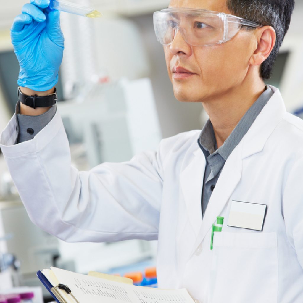 Male Scientist Working In Laboratory Male Scientist Working In Laboratory
